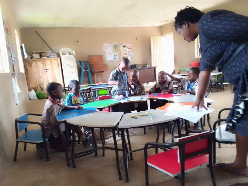 Practitioner supporting a child with additional needs